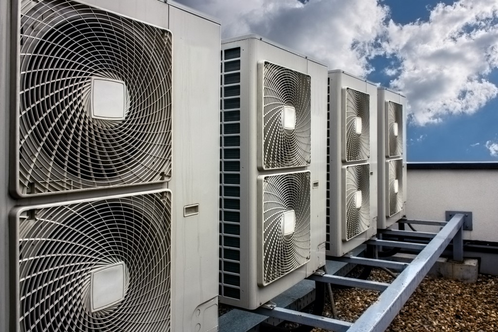 Air conditioning system assembled on side of a building.